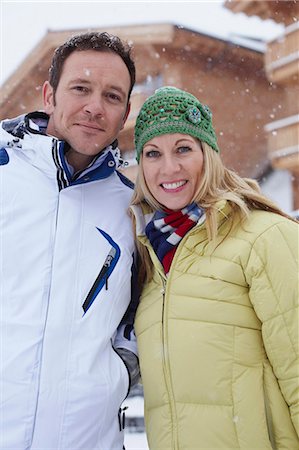Couple smiling together in snow Stock Photo - Premium Royalty-Free, Code: 6122-07704501