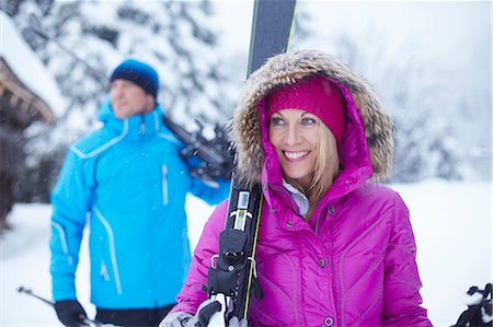 simsearch:6122-07704462,k - Couple carrying skis and poles in snow Stock Photo - Premium Royalty-Free, Code: 6122-07704510