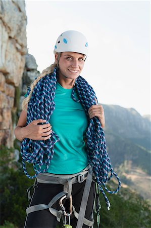 simsearch:649-05949892,k - Climber holding coiled rope on mountain Photographie de stock - Premium Libres de Droits, Code: 6122-07705001
