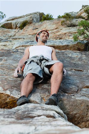 simsearch:649-05949892,k - Climber leaning on steep rock face Photographie de stock - Premium Libres de Droits, Code: 6122-07705006