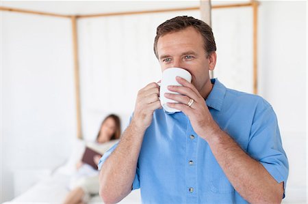 simsearch:6122-07704462,k - Close up of man drinking coffee Stock Photo - Premium Royalty-Free, Code: 6122-07705031