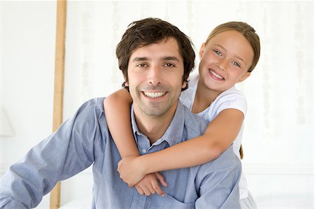 simsearch:649-05649029,k - Father carrying daughter piggy back Stock Photo - Premium Royalty-Free, Code: 6122-07705568