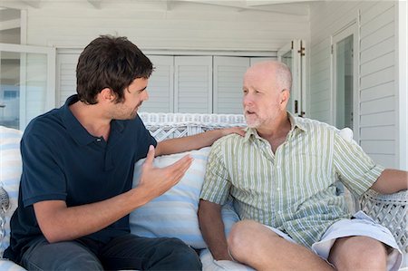 simsearch:649-05656972,k - Father and son talking on sofa Stock Photo - Premium Royalty-Free, Code: 6122-07705584