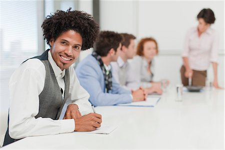 simsearch:6122-07706325,k - Businessman making notes in meeting Stock Photo - Premium Royalty-Free, Code: 6122-07705702