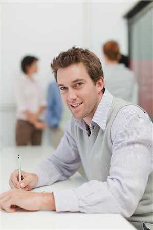 simsearch:6122-07706325,k - Businesswoman making notes in meeting Stock Photo - Premium Royalty-Free, Code: 6122-07705704