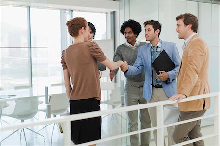 simsearch:649-06000952,k - Business people shaking hands in office Stock Photo - Premium Royalty-Free, Code: 6122-07705717