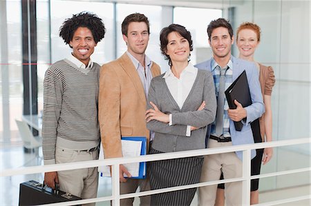 simsearch:6122-07706325,k - Business people smiling in office Stock Photo - Premium Royalty-Free, Code: 6122-07705718