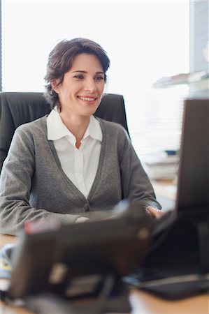 simsearch:649-05648787,k - Businesswoman working on computer Stock Photo - Premium Royalty-Free, Code: 6122-07705720