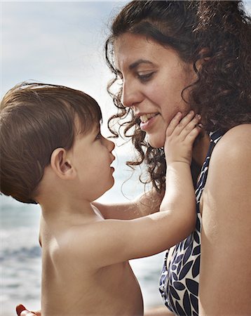 simsearch:400-05119279,k - Toddler boy holding mothers face Stock Photo - Premium Royalty-Free, Code: 6122-07705969