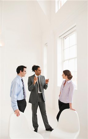 simsearch:614-08030536,k - Business people talking in lobby area Stock Photo - Premium Royalty-Free, Code: 6122-07706033