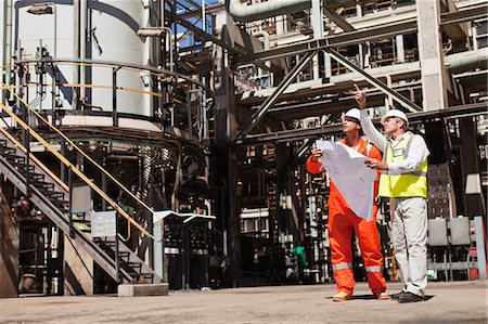 simsearch:649-06040482,k - Workers talking at oil refinery Stock Photo - Premium Royalty-Free, Code: 6122-07706231