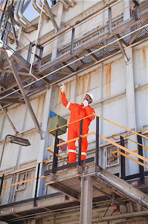 Worker with walkie talkie on site Stock Photo - Premium Royalty-Free, Code: 6122-07706237