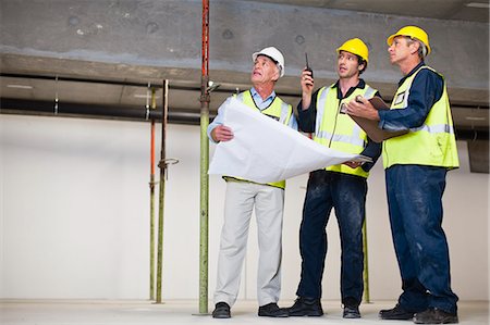 simsearch:649-06040720,k - Workers talking at construction site Stock Photo - Premium Royalty-Free, Code: 6122-07706386
