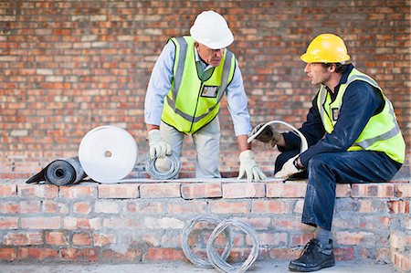 Construction worker on building site Stock Photo - Premium Royalty-Free, Code: 6122-07706391