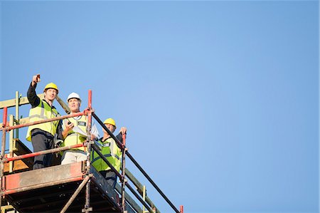 simsearch:649-06040720,k - Workers standing on scaffolding on site Stock Photo - Premium Royalty-Free, Code: 6122-07706398