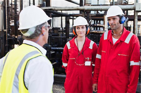simsearch:649-06040426,k - Workers talking at chemical plant Stock Photo - Premium Royalty-Free, Code: 6122-07706312
