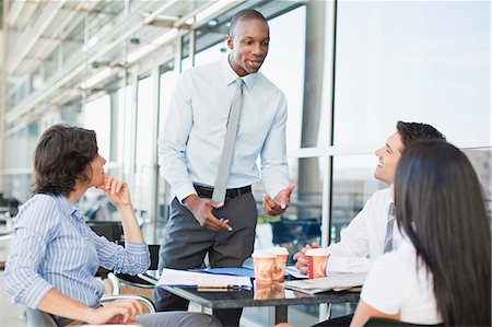 simsearch:6122-07706325,k - Business people working together in cafe Stock Photo - Premium Royalty-Free, Code: 6122-07706322