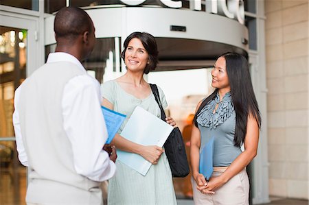 simsearch:649-06040639,k - Business people talking outside building Stock Photo - Premium Royalty-Free, Code: 6122-07706339