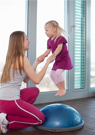 simsearch:649-06041068,k - Girls playing with trampoline in gym Stock Photo - Premium Royalty-Free, Code: 6122-07706448
