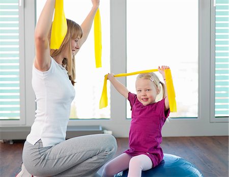simsearch:649-06041068,k - Trainer working with girl in gym Stock Photo - Premium Royalty-Free, Code: 6122-07706455