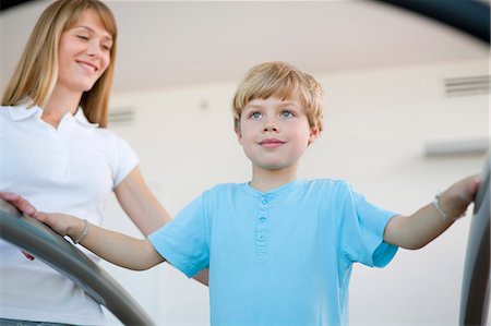 simsearch:649-06041068,k - Trainer working with boy in gym Stock Photo - Premium Royalty-Free, Code: 6122-07706458