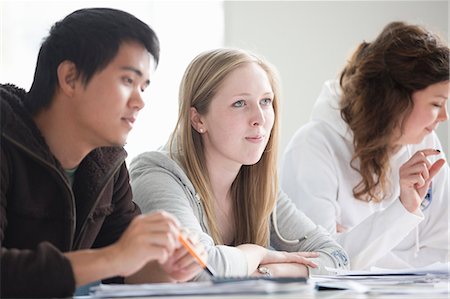 simsearch:649-06041393,k - Students sitting at desk in class Stock Photo - Premium Royalty-Free, Code: 6122-07706487