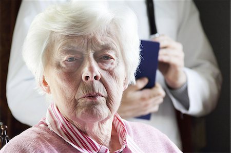 Close up of older womans frowning face Stock Photo - Premium Royalty-Free, Code: 6122-07706579