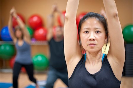 fitness older women gym - Woman practicing yoga in studio Stock Photo - Premium Royalty-Free, Code: 6122-07706647