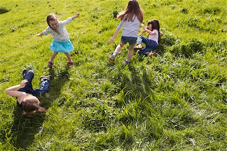 Girls playing together in field Stock Photo - Premium Royalty-Free, Code: 6122-07706698