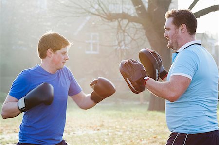 simsearch:614-00657246,k - Boxer training with coach outdoors Stock Photo - Premium Royalty-Free, Code: 6122-07707027