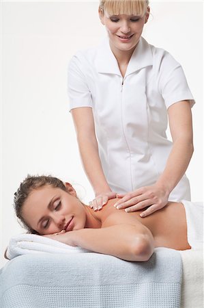 simsearch:649-06164622,k - Smiling woman having back massage Stock Photo - Premium Royalty-Free, Code: 6122-07707359