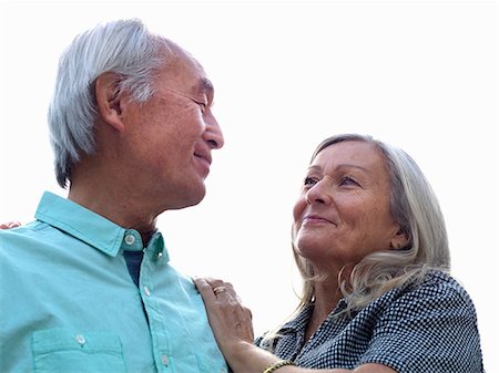 flirt senior woman - Older couple smiling together Photographie de stock - Premium Libres de Droits, Code: 6122-07707326
