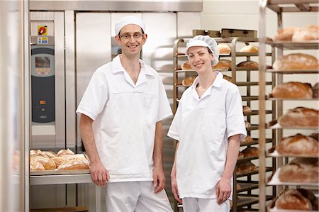 simsearch:649-06165027,k - Chefs smiling together in kitchen Stock Photo - Premium Royalty-Free, Code: 6122-07707502