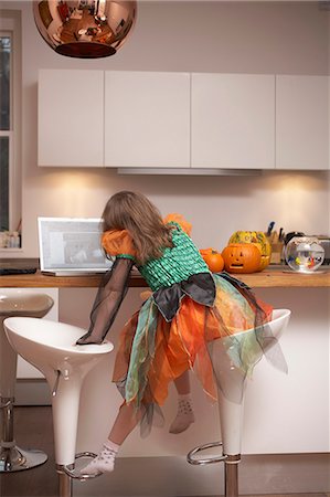 Girl in Halloween costume in kitchen Stock Photo - Premium Royalty-Free, Code: 6122-07707525