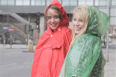 poncho - 2 young women in raincoats in the city Stock Photo - Premium Royalty-Free, Code: 6122-08211870