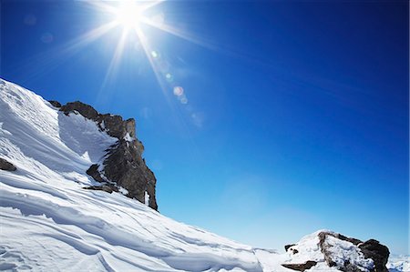 simsearch:649-03857163,k - Sun over snow covered mountain Stock Photo - Premium Royalty-Free, Code: 6122-08211955