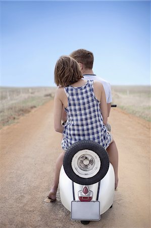 scooter rear view - Couple riding scooter together Stock Photo - Premium Royalty-Free, Code: 6122-08212176