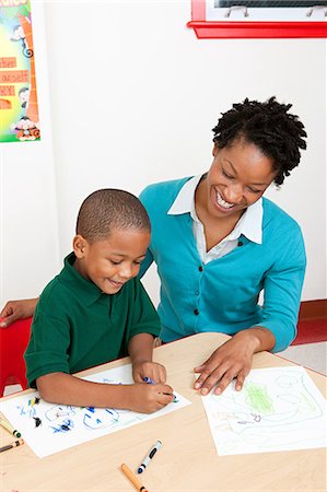 preschool - Teacher and boy drawing a picture Stock Photo - Premium Royalty-Free, Code: 6122-08212585