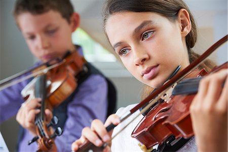 simsearch:649-06716505,k - Serious children playing violin Stock Photo - Premium Royalty-Free, Code: 6122-08229055