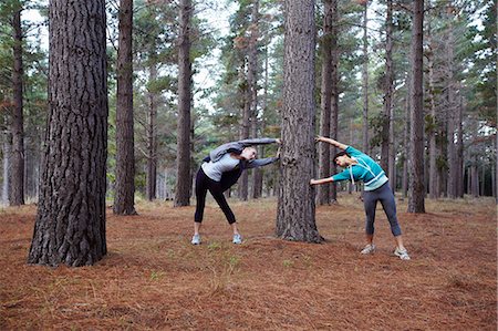 simsearch:695-05768377,k - Runners stretching in forest Stock Photo - Premium Royalty-Free, Code: 6122-08229071