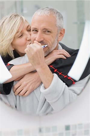 simsearch:649-05521576,k - Man brushing his teeth with wife Stock Photo - Premium Royalty-Free, Code: 6122-08229181