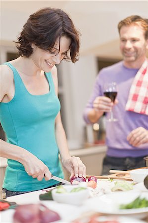 simsearch:649-06717020,k - Woman cooking dinner in kitchen Stock Photo - Premium Royalty-Free, Code: 6122-08229210
