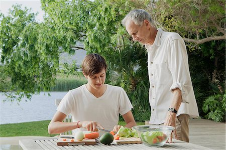 simsearch:649-05656972,k - Father and son making salad outdoors Stock Photo - Premium Royalty-Free, Code: 6122-08229453