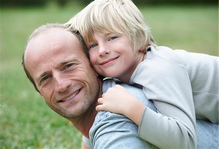 Close up of father and son smiling Stock Photo - Premium Royalty-Free, Code: 6122-08229465