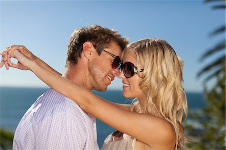 simsearch:649-03796564,k - Smiling couple hugging outdoors Stock Photo - Premium Royalty-Free, Code: 6122-08229494