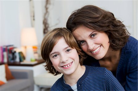 simsearch:649-05800987,k - Mother and son hugging in living room Stock Photo - Premium Royalty-Free, Code: 6122-08229573
