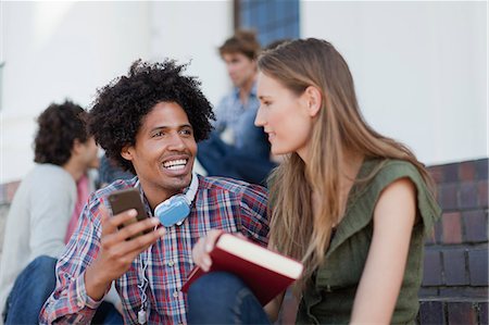 simsearch:614-06537448,k - Students using cell phone on campus Stock Photo - Premium Royalty-Free, Code: 6122-08229597