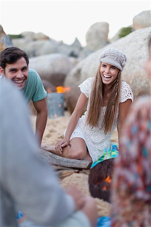 sitting by fire pit - Friends sitting on beach together Stock Photo - Premium Royalty-Free, Code: 6122-08229521