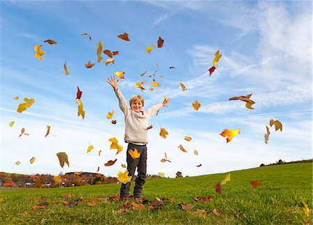 simsearch:649-06623087,k - Boy playing in fall leaves Stock Photo - Premium Royalty-Free, Code: 6122-08229535