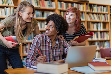 simsearch:614-07031973,k - Students studying together in library Stock Photo - Premium Royalty-Free, Code: 6122-08229601